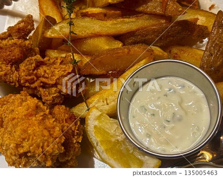 Fried chicken and fried potatoes Fried chicken and fried potatoes 135005463