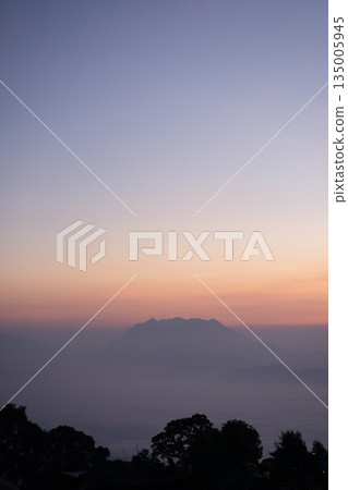 travel and people activity concept with twilight sky before sunrise with mountain and fog on foreground travel and people activity concept with twilight sky before sunrise with mountain and fog on foreground 135005945