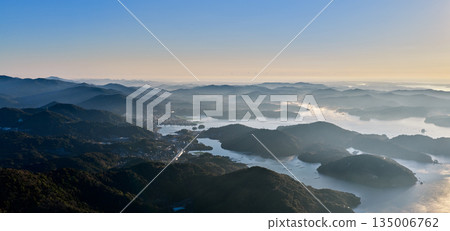 The mountain range of Minamiise Town and the Gokasho Bay inlet bathed in morning light The mountain range of Minamiise Town and the Gokasho Bay inlet bathed in morning light 135006762