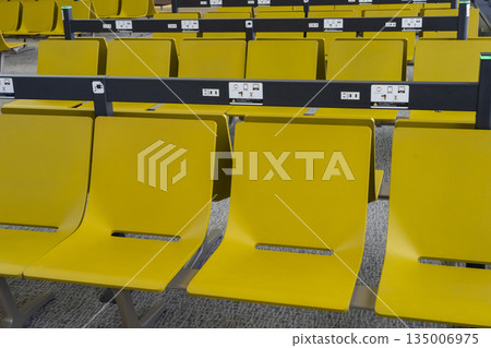 Chairs in the waiting room at Narita Airport 135006975
