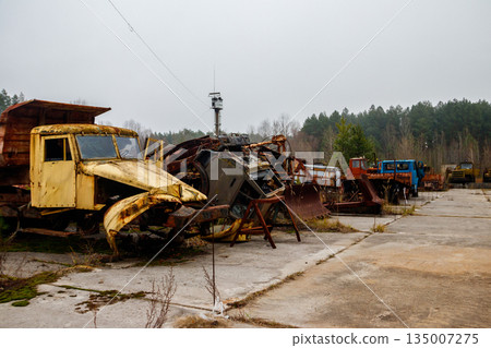 Old rusty abandoned damaged trucks in Chernobyl exclusion zone, Ukraine Old rusty abandoned damaged trucks in Chernobyl exclusion zone, Ukraine 135007275