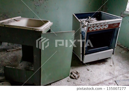 Kitchen of abandoned apartment in the ghost town Pripyat in Chernobyl Exclusion Zone, Ukraine Kitchen of abandoned apartment in the ghost town Pripyat in Chernobyl Exclusion Zone, Ukraine 135007277