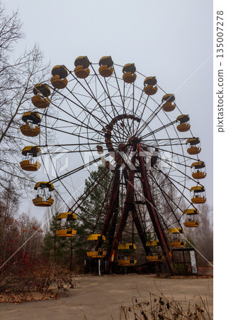 Abandoned Ferris Wheel in the amusement park of ghost town Pripyat in Chernobyl Exclusion Zone, Ukraine Abandoned Ferris Wheel in the amusement park of ghost town Pripyat in Chernobyl Exclusion Zone, Ukraine 135007278