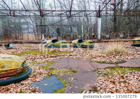 Abandoned bumper cars in the amusement park of Pripyat city in Chernobyl Exclusion Zone, Ukraine Abandoned bumper cars in the amusement park of Pripyat city in Chernobyl Exclusion Zone, Ukraine 135007279