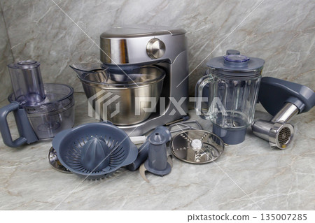 Modern kitchen machine with different attachments and accessories Modern kitchen machine with different attachments and accessories 135007285