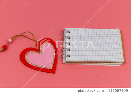 Heart and blank notepad on pastel pink background. Valentine Day concept 135007299