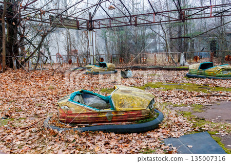 Abandoned bumper cars in the amusement park of Pripyat city in Chernobyl Exclusion Zone, Ukraine Abandoned bumper cars in the amusement park of Pripyat city in Chernobyl Exclusion Zone, Ukraine 135007316