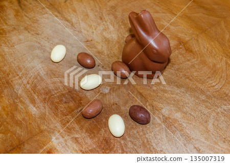 Easter chocolate bunny and chocolate eggs on wooden background 135007319