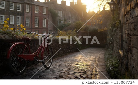 Red Bicycle on Cobblestone Street at Sunset with Historic Buildi 135007724