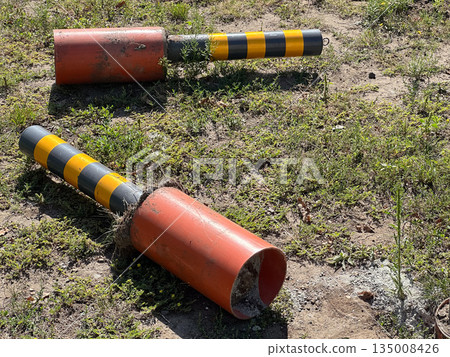 Damaged road bollards taken out from pavement. Damaged road bollards taken out from pavement. 135008426