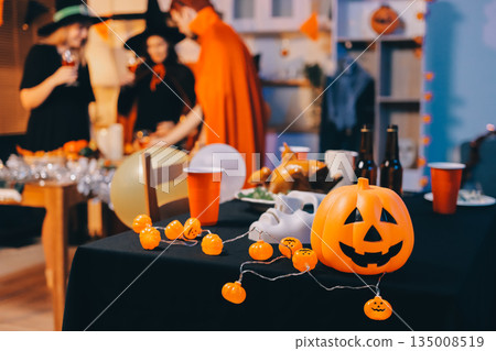 Friends enjoying a Halloween party at a bar making a toast 135008519