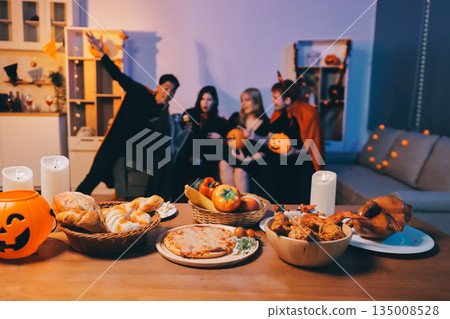 Friends enjoying a Halloween party at a bar making a toast 135008528