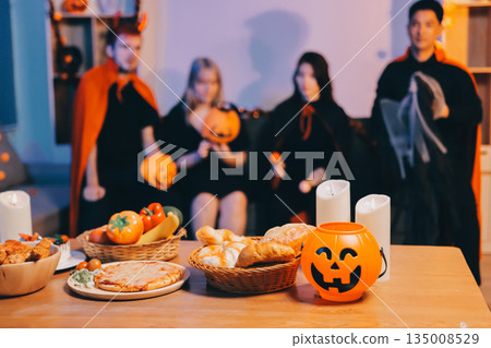Friends enjoying a Halloween party at a bar making a toast Friends enjoying a Halloween party at a bar making a toast 135008529