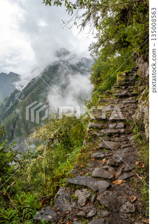 Ancient Inca trail leading to the Inca Bridge - Puente Inca - at Machu Picchu 135008563