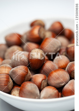 Bowl of dried fruit on a white background Bowl of dried fruit on a white background 135009698