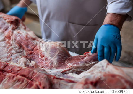 Piece of meat in a butchers's shop Piece of meat in a butchers's shop 135009701