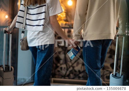 Couple in the hotel ready for check in Couple in the hotel ready for check in 135009878