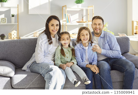 Portrait Of Happy Family With Kids Laughing Together At Home Portrait Of Happy Family With Kids Laughing Together At Home 135009941