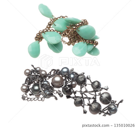 Pearl bead style necklet fly in air. Deep sea pearl bead necklace as gemstone for fashion ornament decorative items. Fashion ornament necklace to add more style. White background isolated 135010026