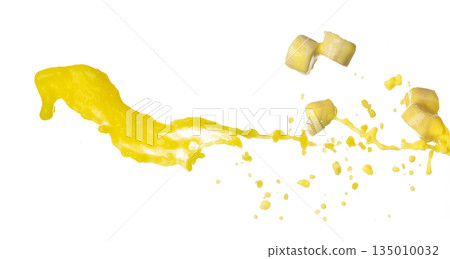 Banana juice flying fall down, yellow banana chopped slice juice wave explode. Yellow paint color splash throwing in Air. White background Isolated high speed shutter, throwing freeze stop motion 135010032