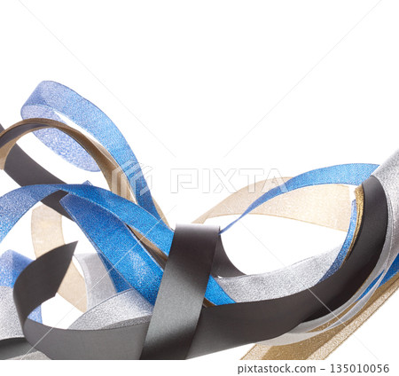 Colorful ribbon long straight fly in air with curve roll shiny. Blue silver gold black ribbon for present gift birthday party to wrap around decorate, blow fly in wind. White background isolated 135010056