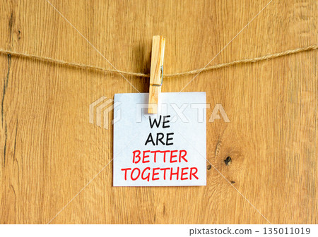 We are better together symbol. Concept words phrase We are better together on beautiful white paper on clothespin. Beautiful wooden background. Business We are better together concept. Copy space. 135011019