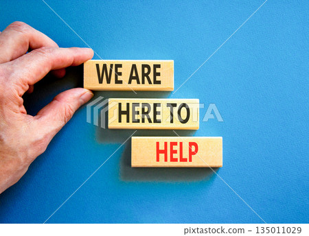 Support, help and we are here to help symbol. Concept words We are here to help on beautiful wooden blocks. Beautiful blue background. Business we are here to help concept. Copy space. Support, help and we are here to help symbol. Concept words We are here to help on beautiful wooden blocks. Beautiful blue background. Business we are here to help concept. Copy space. 135011029