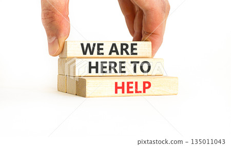 Support, help and we are here to help symbol. Concept words We are here to help on beautiful wooden blocks. Beautiful white background. Business we are here to help concept. Copy space. Support, help and we are here to help symbol. Concept words We are here to help on beautiful wooden blocks. Beautiful white background. Business we are here to help concept. Copy space. 135011043