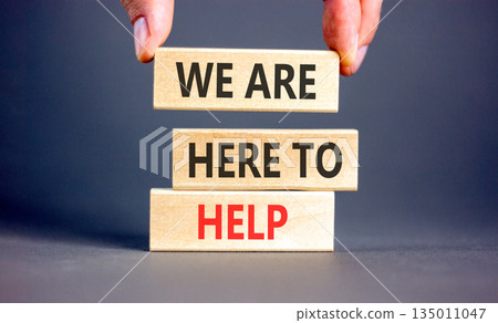 Support, help and we are here to help symbol. Concept words We are here to help on beautiful wooden blocks. Beautiful grey background. Business we are here to help concept. Copy space. Support, help and we are here to help symbol. Concept words We are here to help on beautiful wooden blocks. Beautiful grey background. Business we are here to help concept. Copy space. 135011047