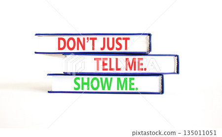 Tell or show symbol. Concept words Do not just tell me, show me on beautiful books. Beautiful white paper background. Business tell or show concept. Copy space. 135011051