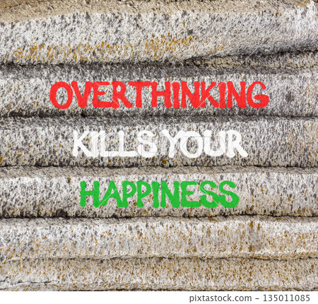 Overthinking kills your happiness symbol. Concept words Overthinking kills your happiness on mountain. Beautiful grey mountain background. Business overthinking kills happiness concept. Copy space. 135011085