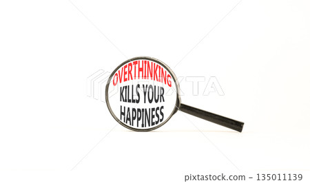 Overthinking kills your happiness symbol. Concept words Overthinking kills your happiness on magnifying glass. Beautiful white background. Business overthinking kills happiness concept. Copy space. 135011139