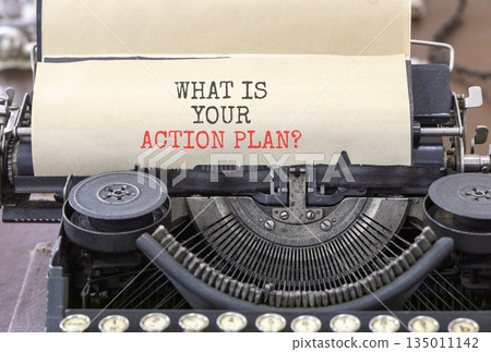 What is your action plan symbol. Concept words What is your action plan typed on beautiful old retro typewriter. Beautiful white paper background. Business what is your action plan concept. Copy space 135011142