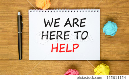 Support, help and we are here to help symbol. Concept words We are here to help on beautiful white note. Beautiful wooden background. Black pen. Business we are here to help concept. Copy space. Support, help and we are here to help symbol. Concept words We are here to help on beautiful white note. Beautiful wooden background. Black pen. Business we are here to help concept. Copy space. 135011154