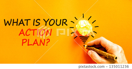 What is your action plan symbol. Concept words What is your action plan on beautiful paper. Beautiful orange background. Businessman's hand. Business what is your action plan concept. Copy space. What is your action plan symbol. Concept words What is your action plan on beautiful paper. Beautiful orange background. Businessman's hand. Business what is your action plan concept. Copy space. 135011236