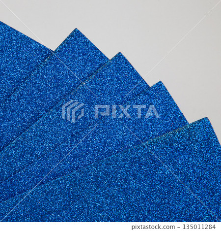 Samples of blue shiny foam sheets. Products for creativity. Samples of blue shiny foam sheets. Products for creativity. 135011284