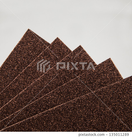 Samples of brown shiny foam sheets. Products for creativity. Samples of brown shiny foam sheets. Products for creativity. 135011289