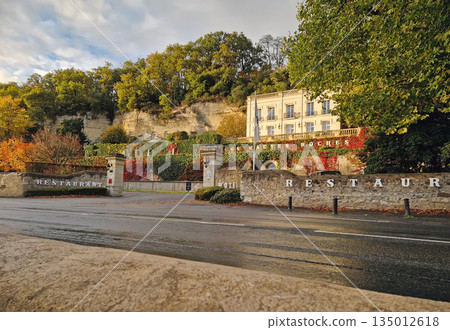 Rochecorbon, France - October 24, 2025: Les Hautes Roches unique hotel with troglodyte dwellings carved directly into a limestone cliff. Classic manor house, world Heritage site Rochecorbon, France - October 24, 2025: Les Hautes Roches unique hotel with troglodyte dwellings carved directly into a limestone cliff. Classic manor house, world Heritage site 135012618