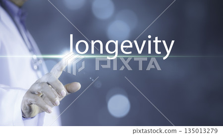 Medical longevity concept. hand of doctor touching a glowing virtual interface with the word longevity on blue technology background. Ideal for healthcare innovation. 135013279