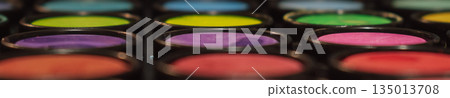 Abstract macro close-up of a colorful makeup or artist paint palette with shallow depth of field. Symbolize creativity, art, and cosmetics 135013708