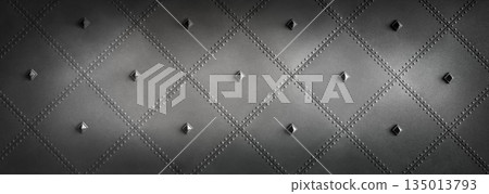 Quilted black metal surface with pyramid rivets 135013793