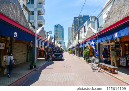Scenery of Monja Street and downtown shopping street in Tsukishima, Tokyo 135014109