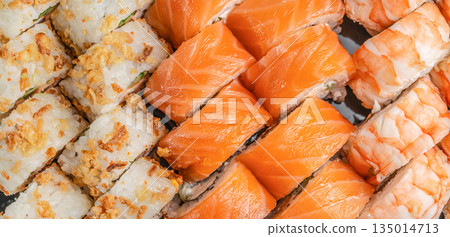 Assorted sushi set with salmon shrimp and crispy rolls top view Assorted sushi set with salmon shrimp and crispy rolls top view 135014713