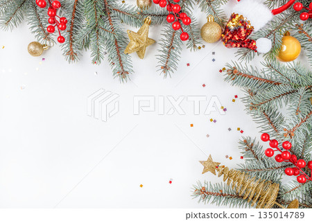 Christmas and New Year festive background with fir branches, ornaments, and decorations on white table, top view, free space for text 135014789