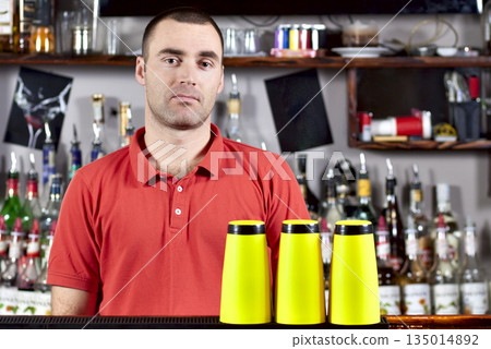 Beautiful barmen in red polo Beautiful barmen in red polo 135014892