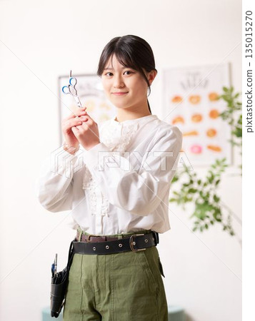 Hair stylist looking at you with a smile 135015270