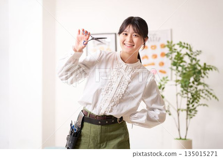 Hair stylist looking at you with a smile 135015271