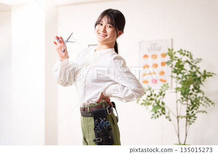 Hair stylist looking at you with a smile 135015273