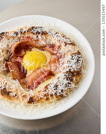 Refined gourmet pizza slice with soft yolk and crispy bacon topping Refined gourmet pizza slice with soft yolk and crispy bacon topping 135015497