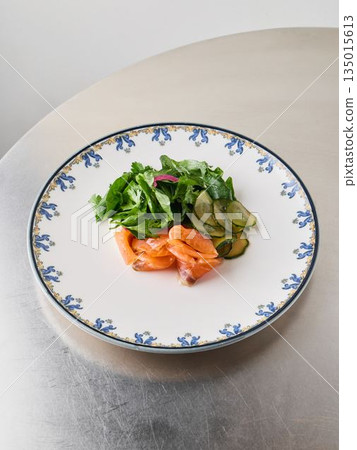Carefully crafted presentation of smoked fish with vibrant vegetables Carefully crafted presentation of smoked fish with vibrant vegetables 135015613